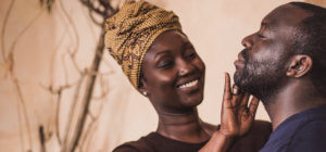 Kafui Awoonor of Kafui Naturals applying beard cream.