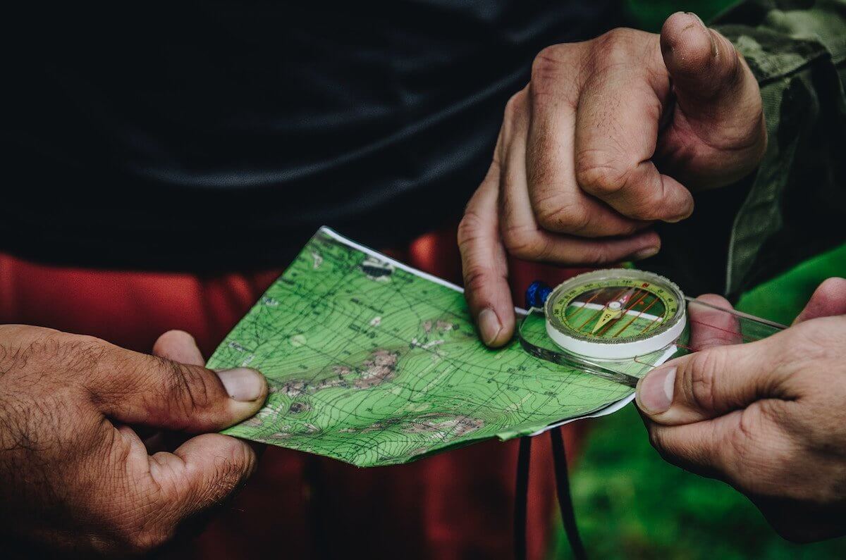 An image of a map and compass in an article about finding business advice and guidance.