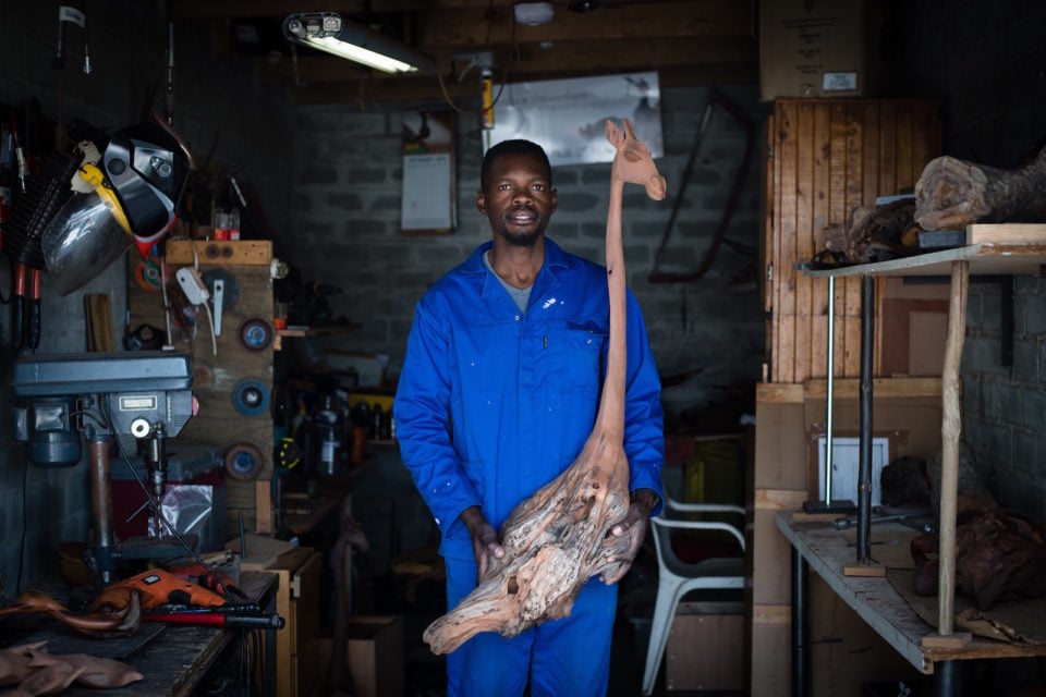 Boniface with one of his sculptures.