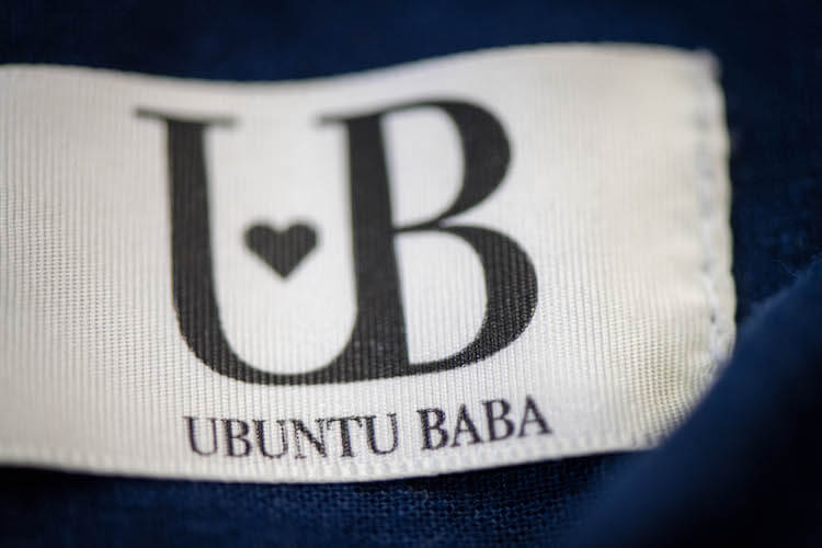 Ubuntu Baba logo stitched onto their baby carrier.