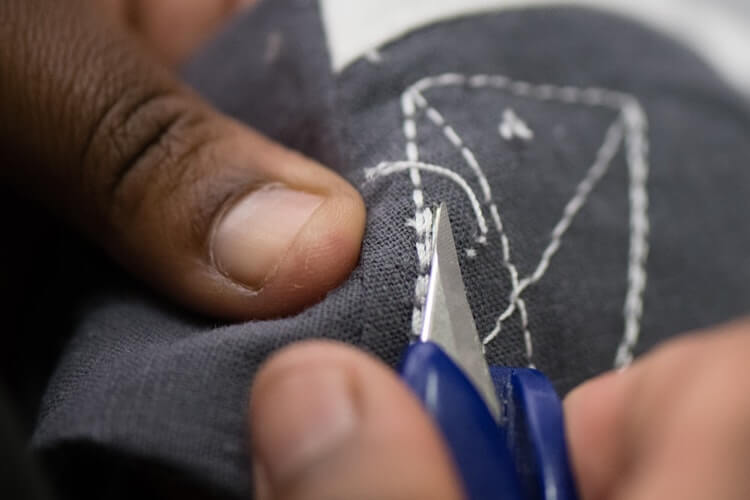 Working the stitching on an Ubuntu Baba baby carrier.