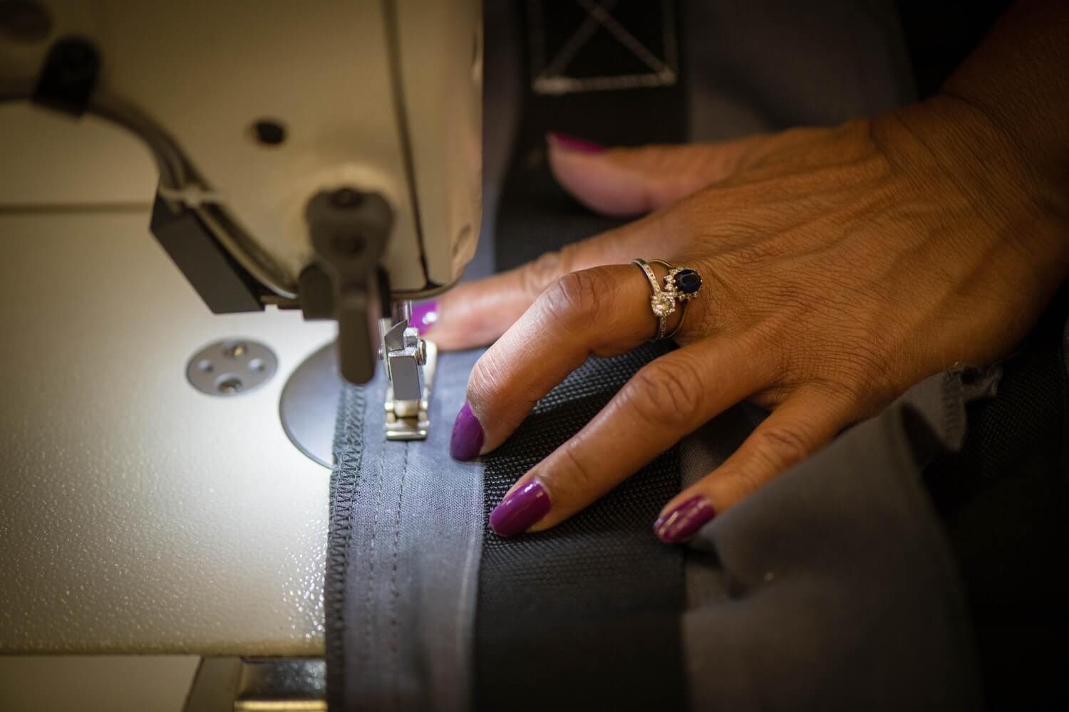 Close up of hands on fabric.