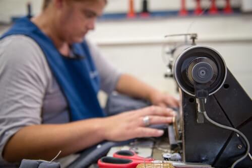 Nicolette working on her sewing machine at Ubuntu Baba.