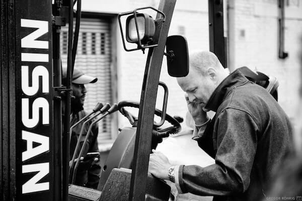 The forklift breaks as packing the gin continues.