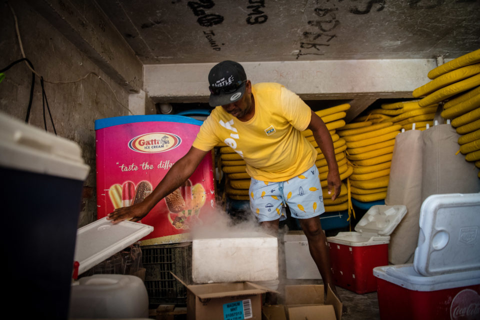 In the storeroom getting supplies to keep selling on the beach.