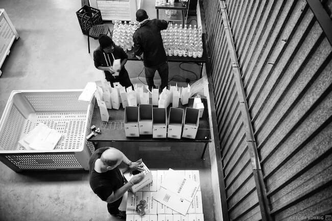 Packing Gin into boxes at Hope on Hopkins.