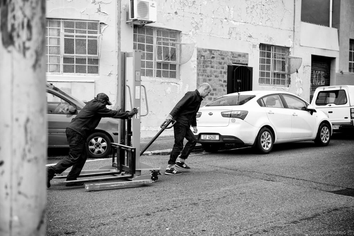 Pulling a trolley into the warehouse.