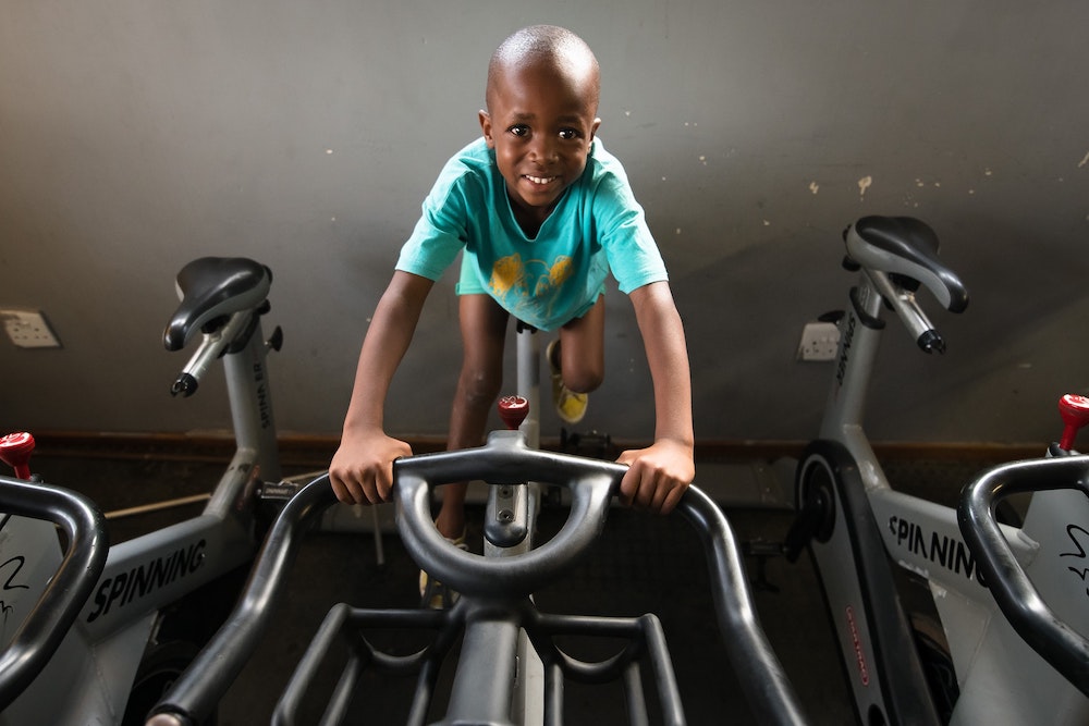 Child riding the Watt bike.