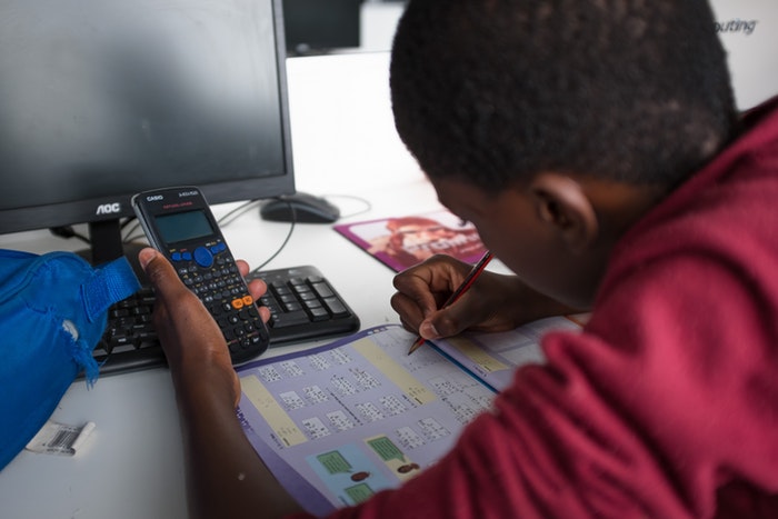 A student doing their homework at Velokhaya.