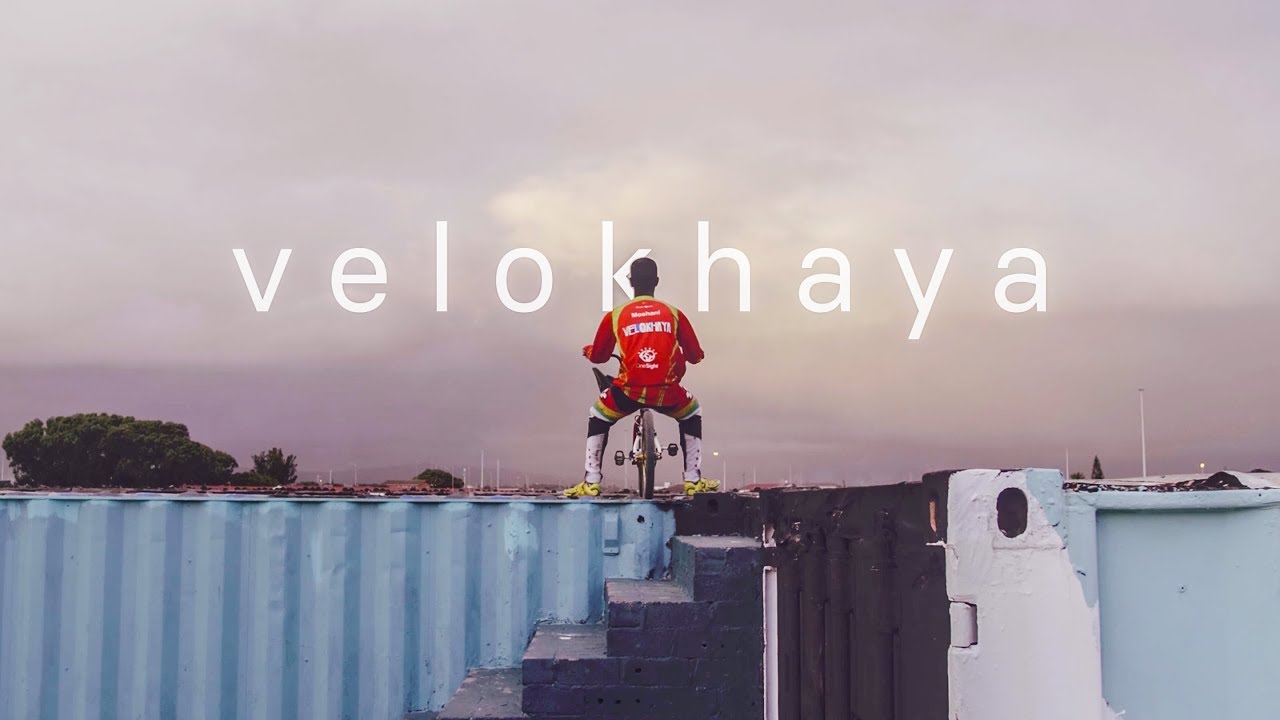 A BMX rider on top of a container at Velokhaya Cycling Academy.