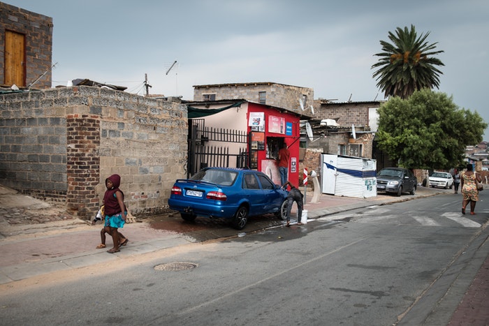 Outside a spaza shop in Alex township.