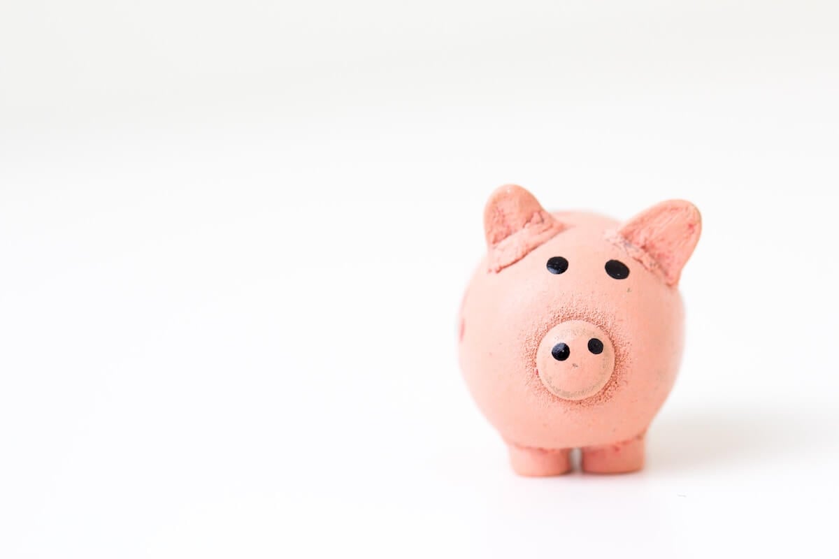 An image of a piggy bank in an article about using personal accounts for business.
