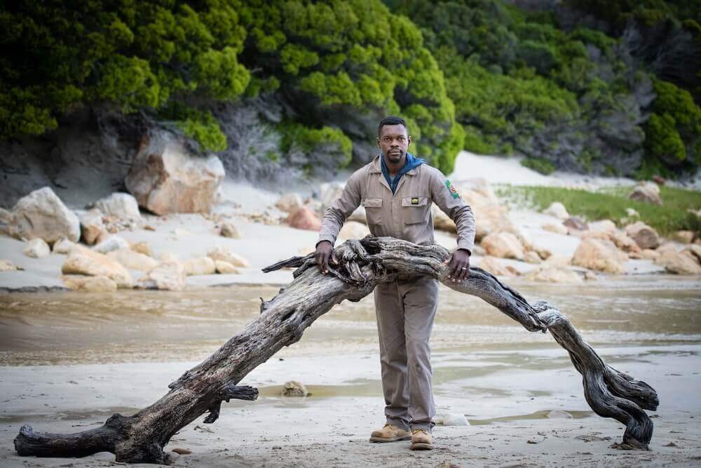 Boniface posing with a promising piece of wood.